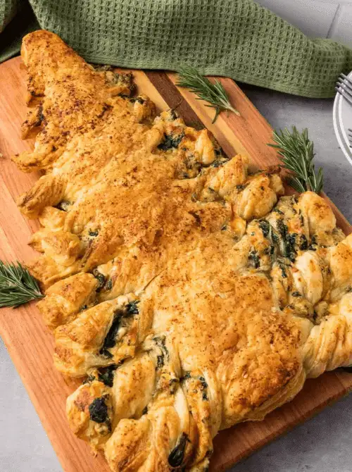 Spinach Dip Christmas Tree made with golden puff pastry and creamy spinach filling — an easy finger food appetizer perfect for Christmas party food ideas, budget-friendly holiday gatherings, and festive make-ahead appetizers for a crowd.