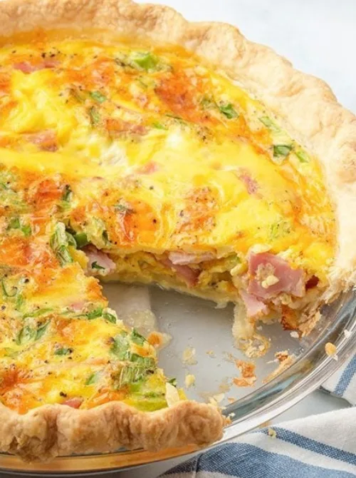 Classic ham and cheese quiche with a golden flaky crust, a comforting and easy dish for Christmas morning breakfast featured in casseroles and quiche recipes.