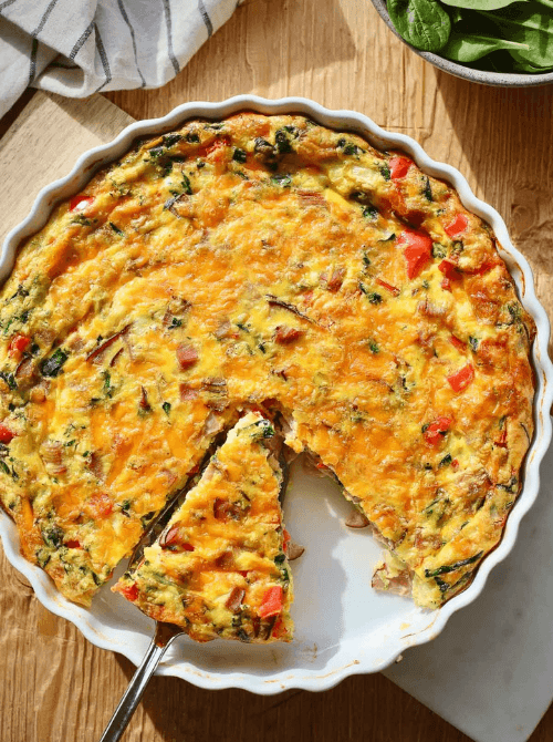 Leek, bacon, and asparagus frittata baked until golden, a colorful and flavorful choice for Christmas morning breakfast featured in casseroles and quiche recipes.
