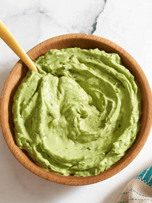 Creamy avocado dip in a wooden bowl, a last minute Super Bowl party dip recipe that’s smooth, fresh, and easy to make.