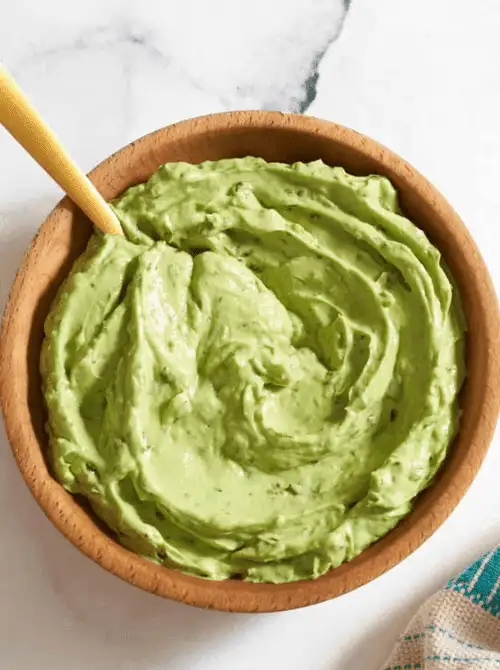 Creamy avocado dip in a wooden bowl, a last minute Super Bowl party dip recipe that’s smooth, fresh, and easy to make.