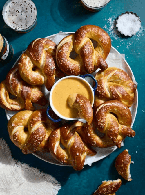 Soft pretzels served with creamy beer cheese dip, a last minute Super Bowl party dip recipe that’s perfect for game day snacking.