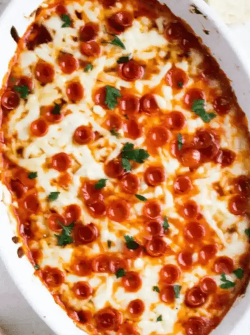 Cheesy pepperoni pizza dip baked in a dish, a crowd-pleasing last minute Super Bowl party dip recipe.