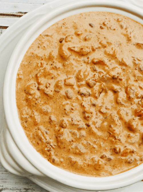 Creamy chili cheese dip in a slow cooker, a last minute Super Bowl party dip recipe that stays warm for game day.
