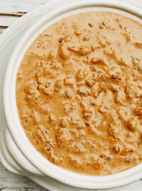 Creamy chili cheese dip in a slow cooker, a last minute Super Bowl party dip recipe that stays warm for game day.
