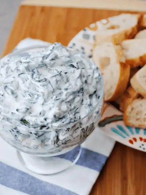 Cold spinach dip with bread slices, an easy last minute party dip recipe for a Super Bowl gathering.