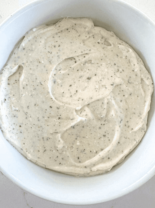 Creamy peppercorn ranch dip in a white bowl, an easy last-minute Super Bowl party dip recipe for chips and veggies.