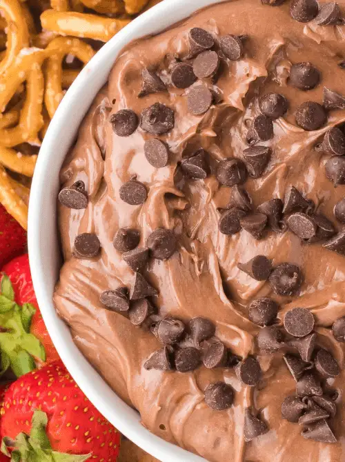 Creamy chocolate dip topped with chocolate chips, served with pretzels and strawberries for a last minute Super Bowl party dip recipe.