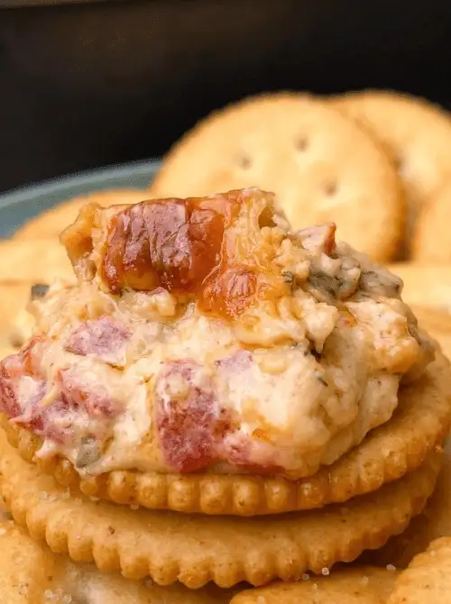 Creamy cheese dip with bacon and peppers served on crackers, a last minute Super Bowl party dip recipe that’s easy to grab and go.