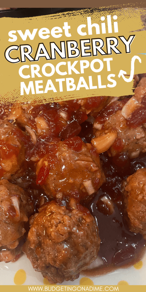 Sweet chili cranberry crockpot meatballs coated in glossy homemade cranberry chili sauce, close-up slow cooker appetizer