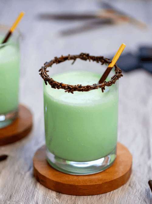 Mint green grasshopper drink with chocolate sprinkle rim, festive no-bake St. Patrick’s Day dessert on a budget.