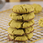 20+ St. Patrick's Day Dessert Buffet Ideas Stack of soft pistachio cookies dipped in chocolate on a cooling rack, featured in festive St. Patrick’s Day Dessert Ideas for a cozy party spread. 🍀