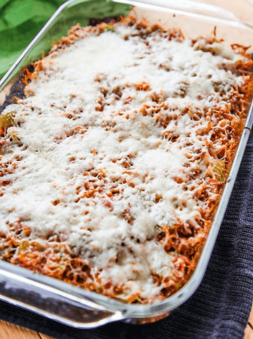 Baked cheesy casserole in a glass 9x13 dish with golden melted mozzarella on top, a comforting choice for super easy casseroles and practical family dinner ideas.