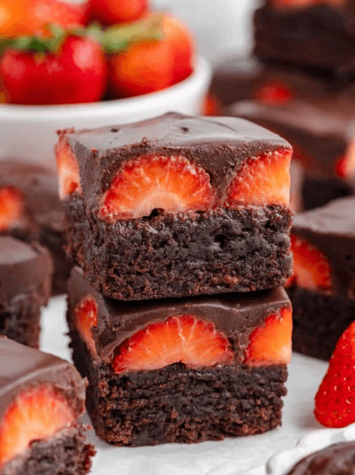 4:36 PMClaude responded: Two fudgy chocolate covered strawberry brownies stacked and showing halved fresh strawberries pressed into dark chocolate ganache — a summer strawberry dessert…Two fudgy chocolate covered strawberry brownies stacked and showing halved fresh strawberries pressed into dark chocolate ganache — a summer strawberry dessert that turns a box of brownie mix into something worth sharing.